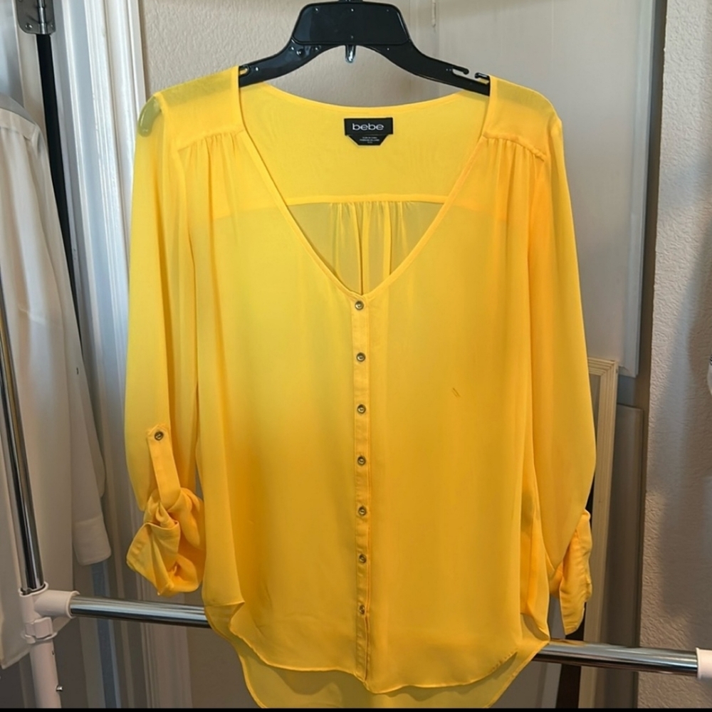 Bebe golden yellow blouse with long sleeves that can be rolled up.